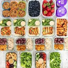 Organized weekly meal layout on a warm kitchen surface
